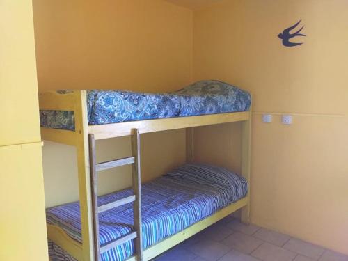 Ένα ή περισσότερα κρεβάτια σε δωμάτιο στο Hostel Joy