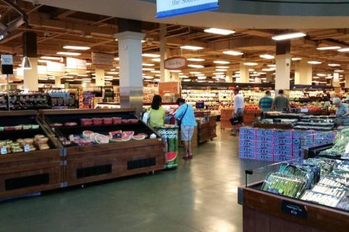 a group of people in a grocery store aisle at Parking - Private Entrance - King Beds in Boston