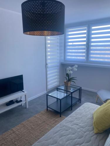 Katil atau katil-katil dalam bilik di APARTAMENT OŚ. JASNE 19B