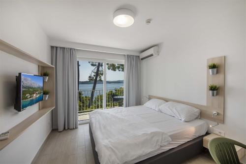 Postel nebo postele na pokoji v ubytování Bellevue Maradiso Casa by Aminess