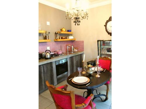 a kitchen with a table and a dining room at Casa Cara Resort in Parys