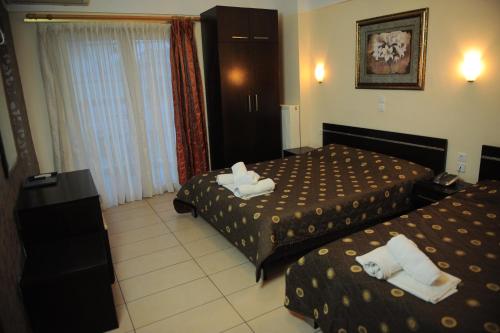 Un pat sau paturi într-o cameră la Hotel San Antonio