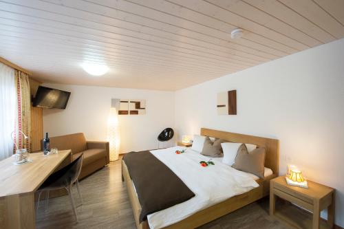 Postel nebo postele na pokoji v ubytování Hotel Tenne