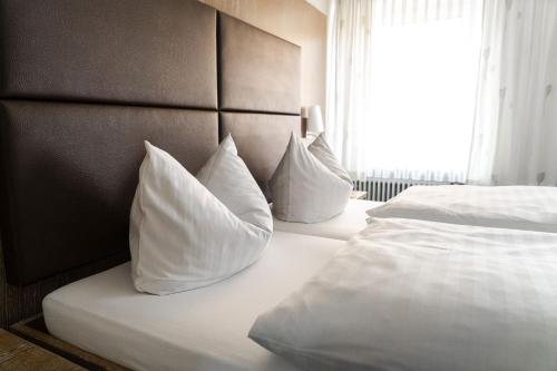 En eller flere senger på et rom på Hotel Restaurant Böhm