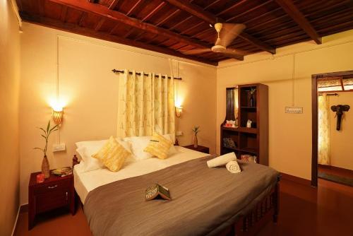 a bedroom with a large bed in a room at Zostel Homes Wayanad, Thirunelly in Wayanad