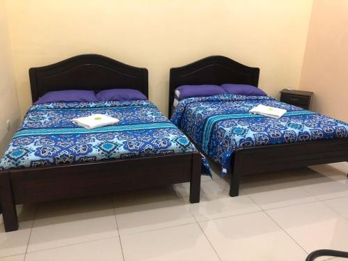 سرير أو أسرّة في غرفة في Hospedaje Adrimaran