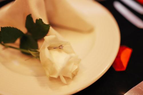 a white plate with a engagement ring on it at Ramada by Wyndham Van in Van