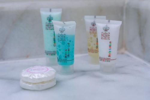 a group of four tubes of sunscreen sitting on a counter at لافنت بارك للشقق المخدومة - إقتصادي in Jeddah