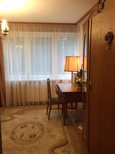 a room with a table with a christmas tree on it at Villa Moderna in Jūrmala