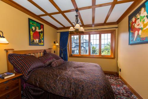 a bedroom with a bed and a window at Woodroyd Estate holiday sanctuary in Island Bay