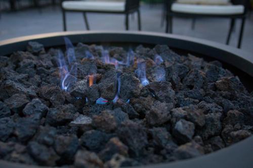a fire pit with a bunch of rocks at Hyatt Place Saltillo in Saltillo