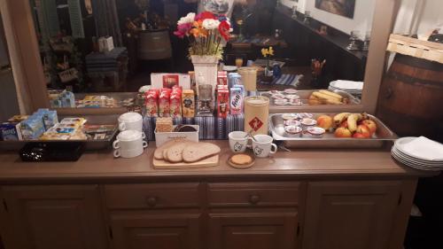 a table with food and drinks on top of it at Schuttershof Heerlen - Adults Only in Heerlen