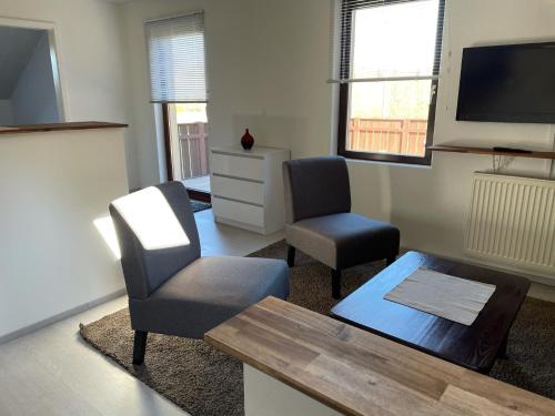 TV a/nebo společenská místnost v ubytování Ferienwohnung Lappano - Losheim am See