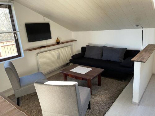 Posezení v ubytování Ferienwohnung Lappano - Losheim am See
