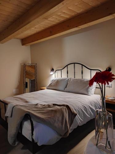 מיטה או מיטות בחדר ב-Le Farfalle di Armeno