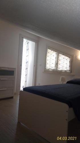 Letto o letti in una camera di B&B IL NIDO