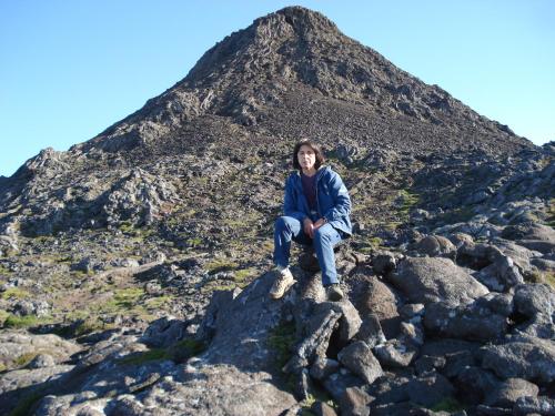 a person sitting on top of a mountain at PICO HOLIDAY RENTALS, Casa Do Avô Faidoca in Calheta de Nesquim