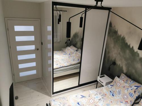 Katil atau katil-katil dalam bilik di Apartament Ryś