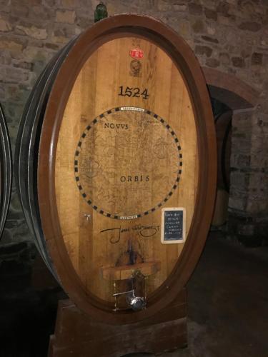 a large wooden wine barrel with a map on it at Casa Panzano Tuscany in Panzano