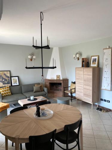 a living room with a table and a couch at Casa Panzano Tuscany in Panzano