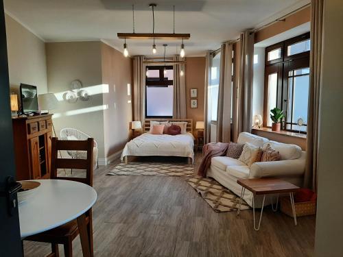 Katil atau katil-katil dalam bilik di Drzewna Apartamenty-Drzewna