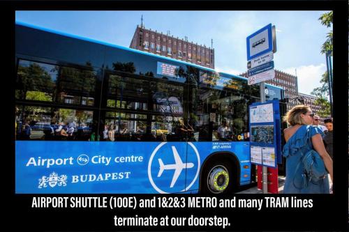 a woman is standing next to a bus at ECONOMY downtown design apartments - FREE PARKING - balcony - super puplic transport - AC in Budapest