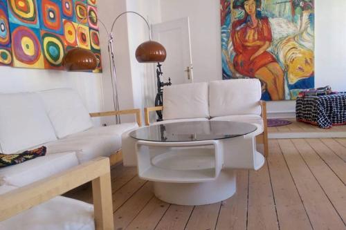 a living room with a couch and a table at The nicest house with internet in Rudkøbing