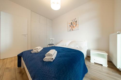 Ένα ή περισσότερα κρεβάτια σε δωμάτιο στο Apartamenty Jurowiecka