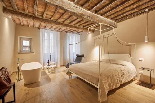 a bedroom with a bed and a desk and a chair at EL TANO in Città della Pieve