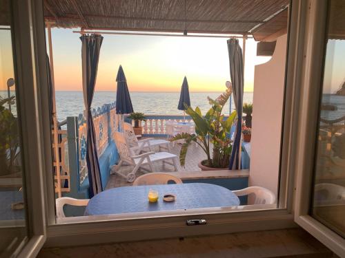 a view of the ocean from the balcony of a house at Appartamenti Tina in Villa Restituta in Ischia