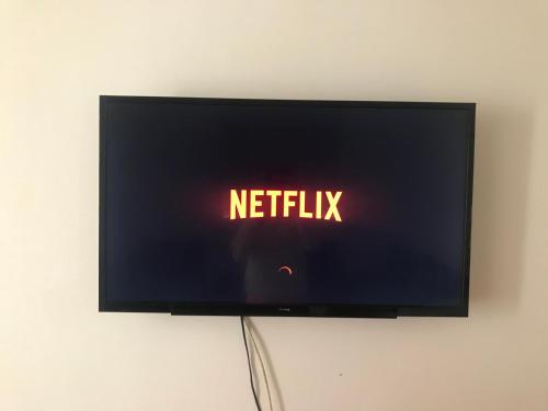 a television screen with the words netflix on it at Love House Tanger in Tangier