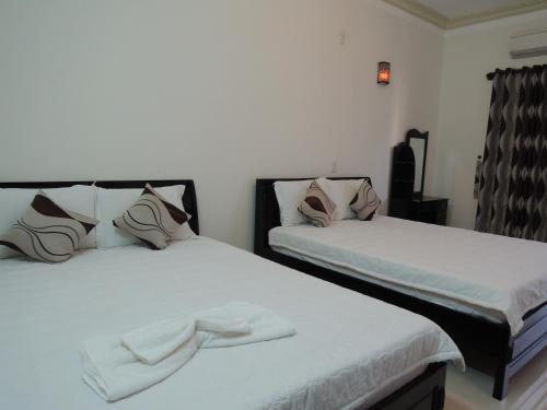 Cama o camas de una habitación en Phuong Tay Guest House