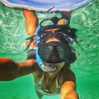 a person in the water with a mask on at Hotel ECOLODGE LE RAVORAHA in Sainte Marie