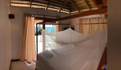 Кровать или кровати в номере Casa del Mar Lodge Barahona