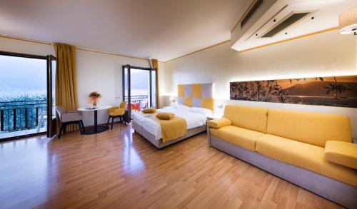 Un pat sau paturi într-o cameră la Hotel Residence Villa Beatrice