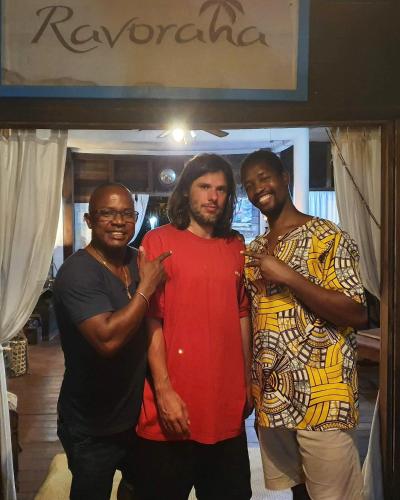 a group of three men posing for a picture at Hotel ECOLODGE LE RAVORAHA in Sainte Marie