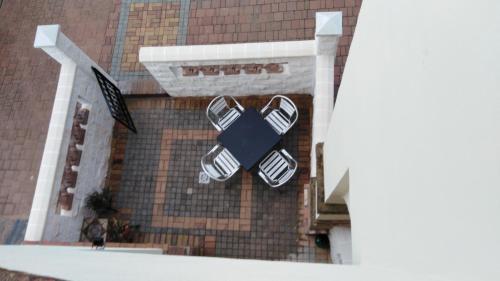 a view of a building with two pairs of shoes at Casas del Madroño in Cazalla de la Sierra