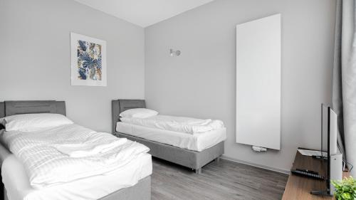 Postel nebo postele na pokoji v ubytování Comfy Apartments - Park Technologiczny