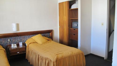 Postel nebo postele na pokoji v ubytování Hotel Parlamento