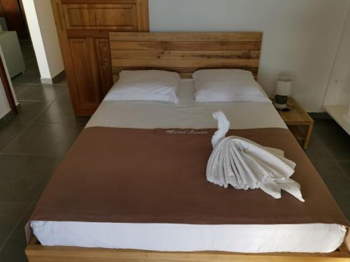 מיטה או מיטות בחדר ב-Villa Maria'Landa