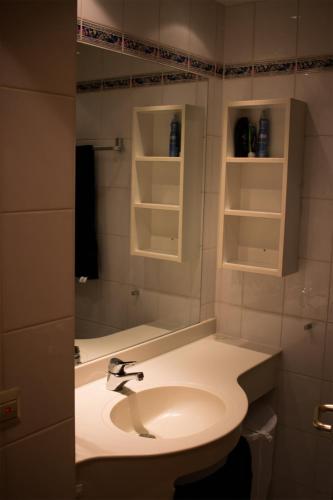 a bathroom with a sink and a mirror at Feriennestchen in Schwangau in Schwangau