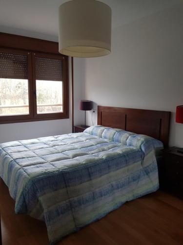 Tempat tidur dalam kamar di Apartamento La Esperanza