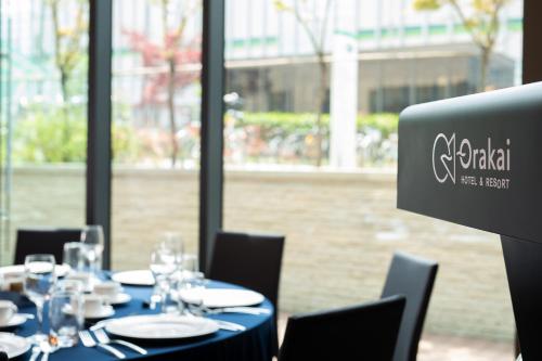 a table with chairs and a sign that says switzerland at Orakai Cheonggyesan Hotel, BW Premier Collection in Seoul