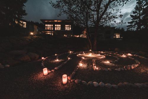 a circle of candles in a yard at night at Maple Rise Guesthouse in Duncan