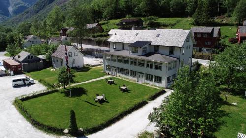 an aerial view of a large house with a yard at Gudvangen Budget Hotel in Gudvangen