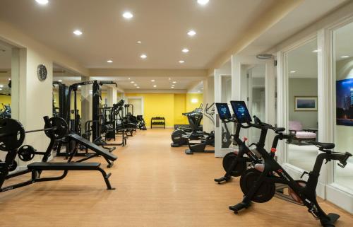 a gym with a row of treadmills and machines at Four Seasons Hotel Atlanta in Atlanta
