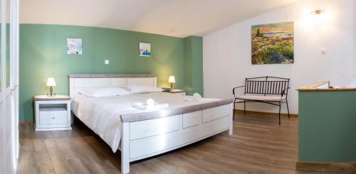 Postel nebo postele na pokoji v ubytování Villa Moreta