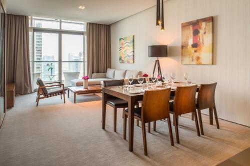 a dining room table and chairs in a room at InterContinental Dubai Marina, an IHG Hotel in Dubai