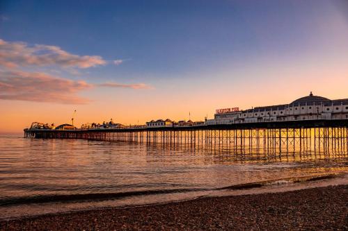 a pier on the beach with the ocean at Brighton Laines Apartments - Central Laines Location in Brighton & Hove