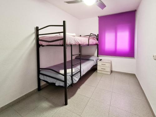 Katil atau katil-katil dalam bilik di Apartamento completo Plaza España II